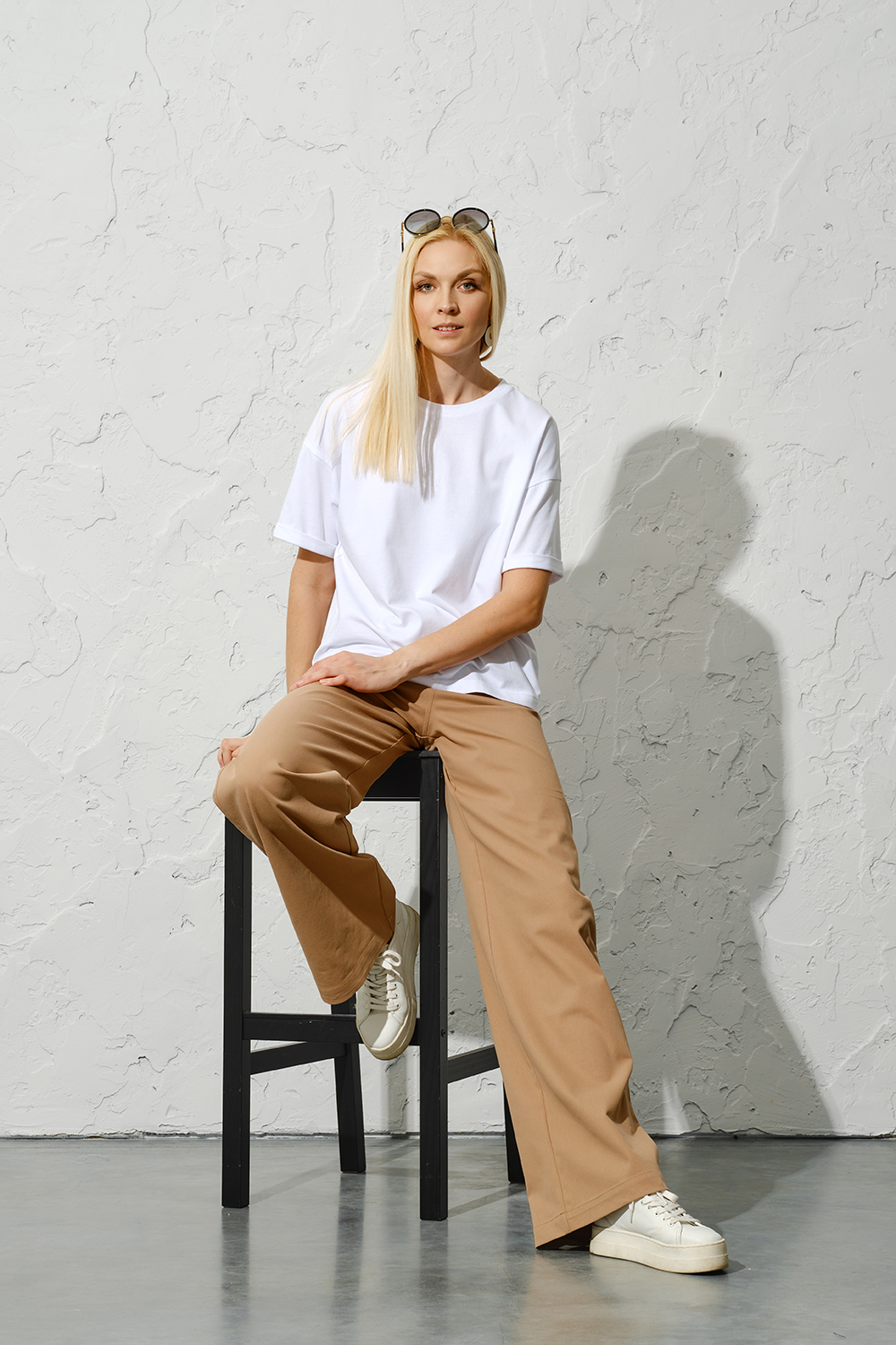 trendy-adult-woman-in-urban-style-outfit-posing-on-2023-12-19-03-34-53-utc